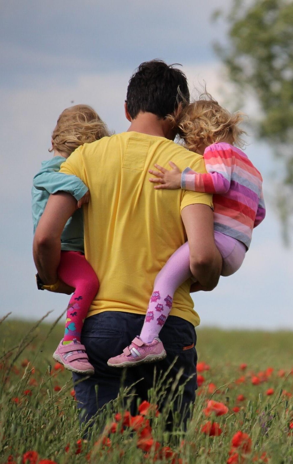 stock image of family in flower fields