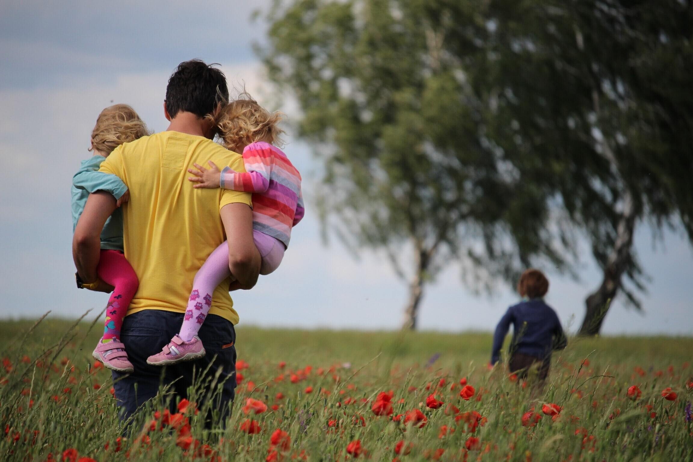 stock image of family in flower fields